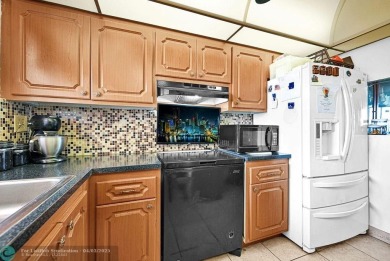 Welcome to this unique 2-bedroom, 2-bathroom corner unit on the on Sunrise Lakes Phase IV Golf Course in Florida - for sale on GolfHomes.com, golf home, golf lot