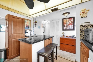 Welcome to this unique 2-bedroom, 2-bathroom corner unit on the on Sunrise Lakes Phase IV Golf Course in Florida - for sale on GolfHomes.com, golf home, golf lot