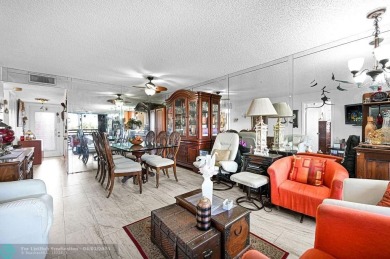 Welcome to this unique 2-bedroom, 2-bathroom corner unit on the on Sunrise Lakes Phase IV Golf Course in Florida - for sale on GolfHomes.com, golf home, golf lot