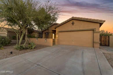 Single-level home with a Large courtyard at the entrance and an on Estrella Mountain Ranch Golf Course in Arizona - for sale on GolfHomes.com, golf home, golf lot