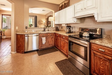Step into a home that instantly wraps you in warmth. Morning on Seville Golf and Country Club in Arizona - for sale on GolfHomes.com, golf home, golf lot