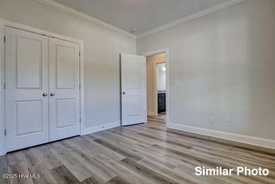 The Otter by American Homesmith offers easy, coastal living in on Lennon Hills Golf Course in North Carolina - for sale on GolfHomes.com, golf home, golf lot