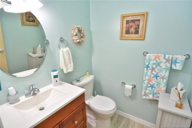 Step into this cozy, beachy-theamed condo and you won't want to on Pine Lakes Golf Club in Florida - for sale on GolfHomes.com, golf home, golf lot