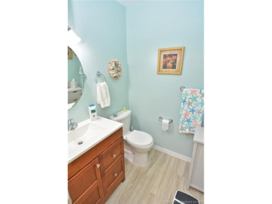 Step into this cozy, beachy-theamed condo and you won't want to on Pine Lakes Golf Club in Florida - for sale on GolfHomes.com, golf home, golf lot