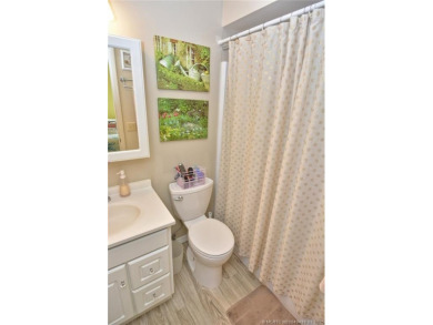 Step into this cozy, beachy-theamed condo and you won't want to on Pine Lakes Golf Club in Florida - for sale on GolfHomes.com, golf home, golf lot