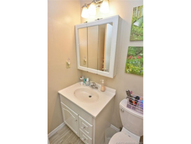 Step into this cozy, beachy-theamed condo and you won't want to on Pine Lakes Golf Club in Florida - for sale on GolfHomes.com, golf home, golf lot