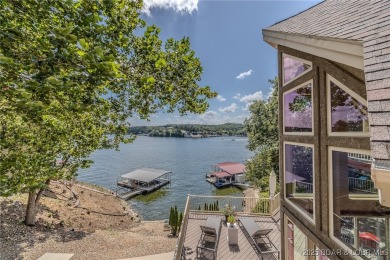Discover your dream lakefront retreat! This stunning 5,700 sq ft on Bayview Golf Course in Missouri - for sale on GolfHomes.com, golf home, golf lot