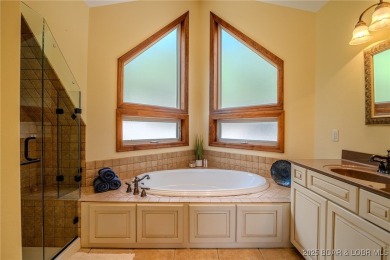Discover your dream lakefront retreat! This stunning 5,700 sq ft on Bayview Golf Course in Missouri - for sale on GolfHomes.com, golf home, golf lot