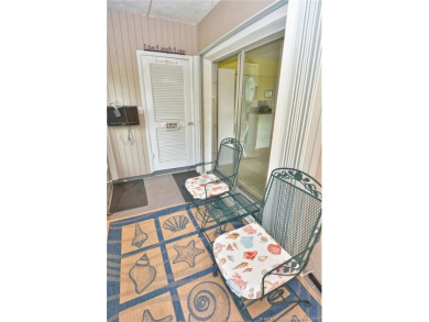 Step into this cozy, beachy-theamed condo and you won't want to on Pine Lakes Golf Club in Florida - for sale on GolfHomes.com, golf home, golf lot