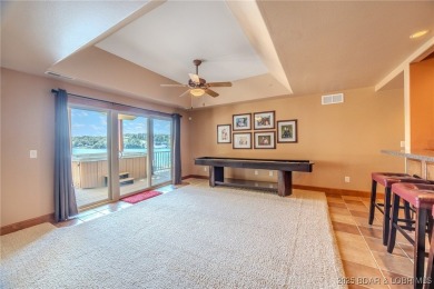 Discover your dream lakefront retreat! This stunning 5,700 sq ft on Bayview Golf Course in Missouri - for sale on GolfHomes.com, golf home, golf lot