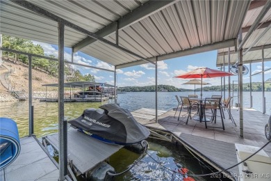 Discover your dream lakefront retreat! This stunning 5,700 sq ft on Bayview Golf Course in Missouri - for sale on GolfHomes.com, golf home, golf lot