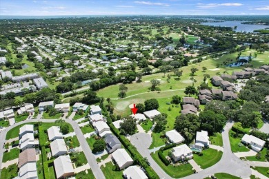 Charming 3-bedroom, 2.5-bath home at 9226 SE Wild Pine Pl on Riverbend Golf Club in Florida - for sale on GolfHomes.com, golf home, golf lot