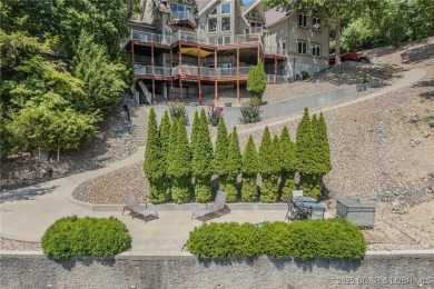 Discover your dream lakefront retreat! This stunning 5,700 sq ft on Bayview Golf Course in Missouri - for sale on GolfHomes.com, golf home, golf lot