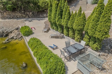 Discover your dream lakefront retreat! This stunning 5,700 sq ft on Bayview Golf Course in Missouri - for sale on GolfHomes.com, golf home, golf lot