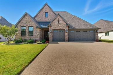 This stunning Pecan Plantation home offers peaceful views of a on Pecan Plantation Country Club in Texas - for sale on GolfHomes.com, golf home, golf lot