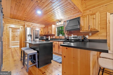 Nestled atop a gentle hill and surrounded by graceful Hemlocks on White Path Golf Club in Georgia - for sale on GolfHomes.com, golf home, golf lot