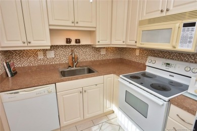 This first floor one bedroom, corner location with one and a on Pine Lakes Golf Club in Florida - for sale on GolfHomes.com, golf home, golf lot