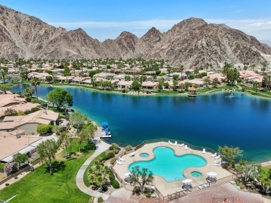 The home is located in the Guard Gated Lake community of Laguna on La Quinta Golf  Resort and Country Clubs in California - for sale on GolfHomes.com, golf home, golf lot