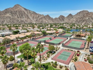 The home is located in the Guard Gated Lake community of Laguna on La Quinta Golf  Resort and Country Clubs in California - for sale on GolfHomes.com, golf home, golf lot