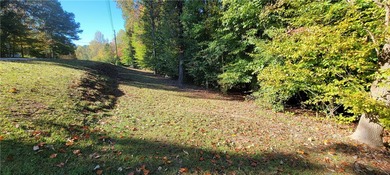 Rare mostly level double lot on Point road is now available for on The Trail At Chickasaw Pointe in South Carolina - for sale on GolfHomes.com, golf home, golf lot