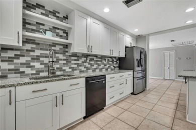 Located in FOREST HILLS, this charming Mid-Century home sits on on Babe Zaharias Golf Course in Florida - for sale on GolfHomes.com, golf home, golf lot