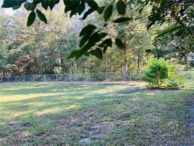 Charming three-bedroom, two-bathroom home featuring a two-car on Pine Ridge Community Golf and Country Club in Florida - for sale on GolfHomes.com, golf home, golf lot