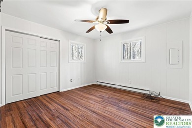 Experience lake living and year around amenities in the heart of on Lake Naomi Timber Trails Golf Club in Pennsylvania - for sale on GolfHomes.com, golf home, golf lot