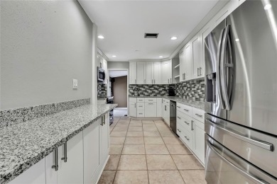 Located in FOREST HILLS, this charming Mid-Century home sits on on Babe Zaharias Golf Course in Florida - for sale on GolfHomes.com, golf home, golf lot