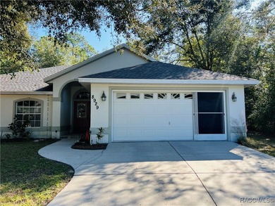 Charming three-bedroom, two-bathroom home featuring a two-car on Pine Ridge Community Golf and Country Club in Florida - for sale on GolfHomes.com, golf home, golf lot