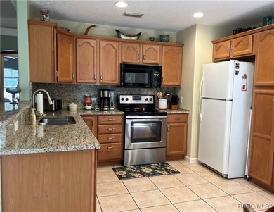 Charming three-bedroom, two-bathroom home featuring a two-car on Pine Ridge Community Golf and Country Club in Florida - for sale on GolfHomes.com, golf home, golf lot