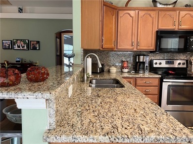 Charming three-bedroom, two-bathroom home featuring a two-car on Pine Ridge Community Golf and Country Club in Florida - for sale on GolfHomes.com, golf home, golf lot