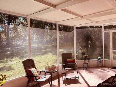 Charming three-bedroom, two-bathroom home featuring a two-car on Pine Ridge Community Golf and Country Club in Florida - for sale on GolfHomes.com, golf home, golf lot