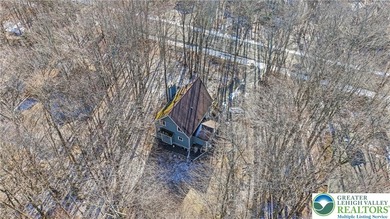 Experience lake living and year around amenities in the heart of on Lake Naomi Timber Trails Golf Club in Pennsylvania - for sale on GolfHomes.com, golf home, golf lot