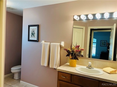 Charming three-bedroom, two-bathroom home featuring a two-car on Pine Ridge Community Golf and Country Club in Florida - for sale on GolfHomes.com, golf home, golf lot