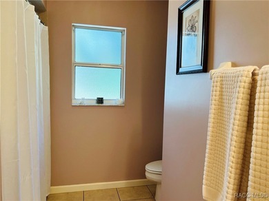 Charming three-bedroom, two-bathroom home featuring a two-car on Pine Ridge Community Golf and Country Club in Florida - for sale on GolfHomes.com, golf home, golf lot