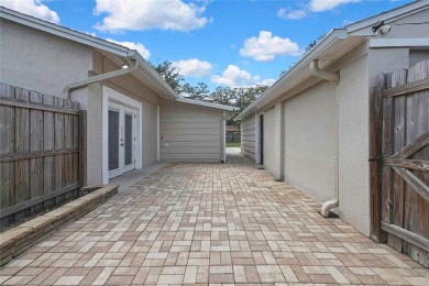 Located in FOREST HILLS, this charming Mid-Century home sits on on Babe Zaharias Golf Course in Florida - for sale on GolfHomes.com, golf home, golf lot