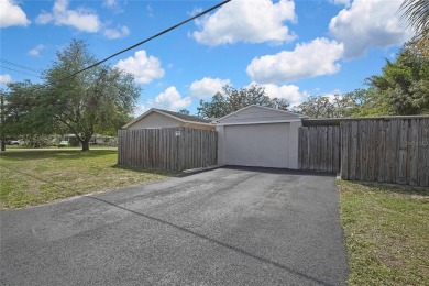Located in FOREST HILLS, this charming Mid-Century home sits on on Babe Zaharias Golf Course in Florida - for sale on GolfHomes.com, golf home, golf lot