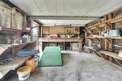 Located in FOREST HILLS, this charming Mid-Century home sits on on Babe Zaharias Golf Course in Florida - for sale on GolfHomes.com, golf home, golf lot