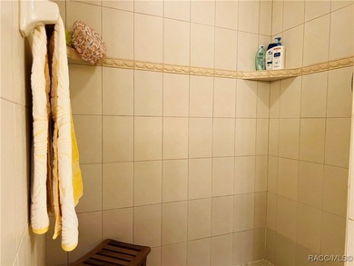 Charming three-bedroom, two-bathroom home featuring a two-car on Pine Ridge Community Golf and Country Club in Florida - for sale on GolfHomes.com, golf home, golf lot