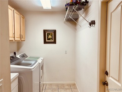 Charming three-bedroom, two-bathroom home featuring a two-car on Pine Ridge Community Golf and Country Club in Florida - for sale on GolfHomes.com, golf home, golf lot