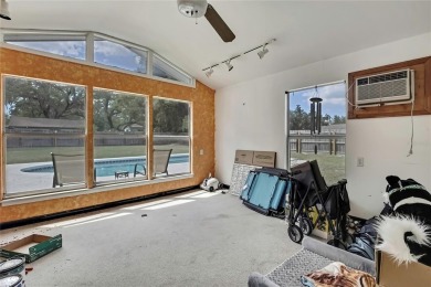 Located in FOREST HILLS, this charming Mid-Century home sits on on Babe Zaharias Golf Course in Florida - for sale on GolfHomes.com, golf home, golf lot