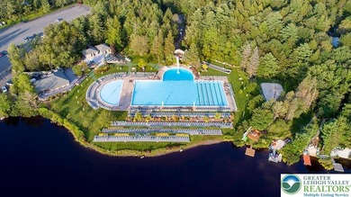 Experience lake living and year around amenities in the heart of on Lake Naomi Timber Trails Golf Club in Pennsylvania - for sale on GolfHomes.com, golf home, golf lot