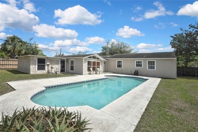 Located in FOREST HILLS, this charming Mid-Century home sits on on Babe Zaharias Golf Course in Florida - for sale on GolfHomes.com, golf home, golf lot