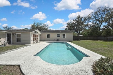 Located in FOREST HILLS, this charming Mid-Century home sits on on Babe Zaharias Golf Course in Florida - for sale on GolfHomes.com, golf home, golf lot