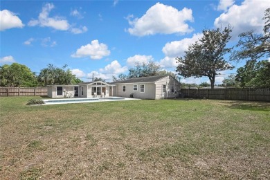 Located in FOREST HILLS, this charming Mid-Century home sits on on Babe Zaharias Golf Course in Florida - for sale on GolfHomes.com, golf home, golf lot