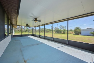 Beautiful family home on a full acre (2 lots) in the lake and on Indian Lake Estates Golf and Country Club in Florida - for sale on GolfHomes.com, golf home, golf lot