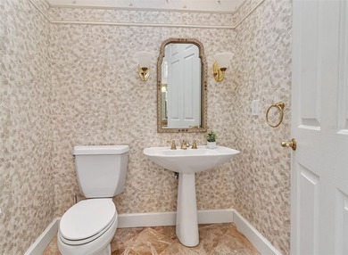 Although built in the 20th century, this home looks as authentic on The Oaks Club in Florida - for sale on GolfHomes.com, golf home, golf lot