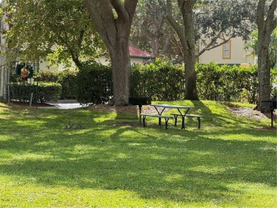 This spacious condo has updraded travertine tile throughout on Gateway Golf and Country Club in Florida - for sale on GolfHomes.com, golf home, golf lot
