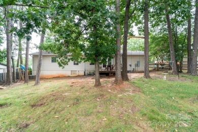 Lake view, large flat yard, fully updated, and truly move-in on Tega Cay Golf Club in South Carolina - for sale on GolfHomes.com, golf home, golf lot
