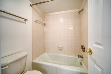 This is the best-priced unit in Villas de Golf and is available on Largo Golf Course in Florida - for sale on GolfHomes.com, golf home, golf lot